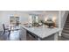 Modern kitchen island featuring granite countertops, stainless steel appliances, and seamless connection to the outdoors at 128 Shucking St., Myrtle Beach, SC 29588