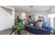 Comfortable living room area with modern gray tones flowing seamlessly into the eat-in kitchen and stainless steel appliances at 128 Shucking St., Myrtle Beach, SC 29588