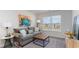 Cozy living room with comfortable seating, bright window, and natural light for a welcoming and relaxing atmosphere at 128 Shucking St., Myrtle Beach, SC 29588