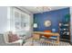 Bright office space featuring a wooden desk, comfortable chair, and blue accent wall for a modern touch at 128 Shucking St., Myrtle Beach, SC 29588