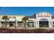 Shopping center with storefronts for Kirkland's and Wild Mab Clothing Co. on a sunny day at 128 Shucking St., Myrtle Beach, SC 29588