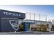 The outside view of Topgolf showcasing the driving range netting and architectural design at 128 Shucking St., Myrtle Beach, SC 29588