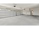 Spacious garage with ample parking, modern doors, and an entryway to the home at 1328 Foxtail Dr., Longs, SC 29568