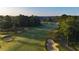 Aerial view of the lush green Long Bay Club golf course with sand traps at 1328 Foxtail Dr., Longs, SC 29568