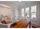 Well-lit home office featuring built-in shelving, a wooden desk, and comfortable seating at 1328 Foxtail Dr., Longs, SC 29568