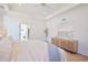 Bright primary bedroom features a tray ceiling, neutral decor, and an ensuite bathroom at 1328 Foxtail Dr., Longs, SC 29568