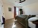 Comfortable bedroom with wood-look flooring, ceiling fan, and natural light from the window at 160 Leadwood St., Andrews, SC 29510