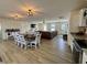 Open concept living space with dining area, living room, and kitchen with wood-look flooring at 160 Leadwood St., Andrews, SC 29510