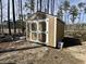 Outdoor shed with double doors and a neutral color scheme, ideal for storage at 160 Leadwood St., Andrews, SC 29510