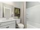 Neat bathroom featuring a shower-tub combo, vanity, light walls, and stylish finishes at 1800 Hardwood Ct., Conway, SC 29526