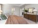Spacious bedroom with a decorative mirror above a wooden dresser and neutral bedding at 1800 Hardwood Ct., Conway, SC 29526