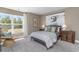Inviting bedroom featuring a window with natural light, and a comfortable wicker chair at 1800 Hardwood Ct., Conway, SC 29526