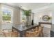 Inviting dining room with large windows providing ample natural light at 1800 Hardwood Ct., Conway, SC 29526