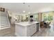 Modern kitchen with a large island, stainless steel appliances, and open access to the living and dining areas at 1800 Hardwood Ct., Conway, SC 29526