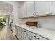 Bright kitchen with white cabinets, quartz countertops, and tile backsplash at 1800 Hardwood Ct., Conway, SC 29526