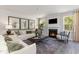 Inviting living room featuring a fireplace, large windows, comfortable seating, and elegant decor at 1800 Hardwood Ct., Conway, SC 29526