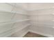 Spacious walk-in pantry with ample shelving for organized storage at 1800 Hardwood Ct., Conway, SC 29526