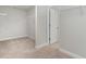 This walk-in closet is carpeted and features ample storage with bright white trim at 1800 Hardwood Ct., Conway, SC 29526