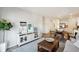 Open-concept living room with dining area and modern kitchen beyond at 2049 Victory Way # 513, Myrtle Beach, SC 29579