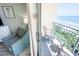 Enjoy the view of the ocean and beach from the balcony with a chair and table, perfect for relaxing by the sea at 2106 N Ocean Blvd. # 712, Myrtle Beach, SC 29577
