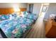 Comfortable bedroom has two beds and a view to the balcony at 2106 N Ocean Blvd. # 712, Myrtle Beach, SC 29577