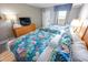 Well-lit, tropical-themed bedroom with comfortable beds and ample natural light at 2106 N Ocean Blvd. # 712, Myrtle Beach, SC 29577