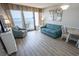 Bright living room with seating and ocean view at 2106 N Ocean Blvd. # 712, Myrtle Beach, SC 29577