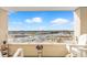 Comfortable balcony seating with panoramic view of the harbor and clear blue sky at 2151 Bridge View Ct. # 11003, North Myrtle Beach, SC 29582