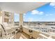 Spacious balcony seating with panoramic view of the waterway and blue skies at 2151 Bridge View Ct. # 11003, North Myrtle Beach, SC 29582
