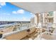 Relaxing balcony seating with view of waterway, pool, and beach at 2151 Bridge View Ct. # 1003, North Myrtle Beach, SC 29582