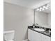 Well-lit bathroom features a granite countertop and white vanity with cabinet storage at 2151 Bridge View Ct. # 11003, North Myrtle Beach, SC 29582