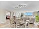 Open-concept dining area connects living spaces, enhanced by natural light and views from large windows at 2151 Bridge View Ct. # 11003, North Myrtle Beach, SC 29582