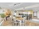 Dining area flowing to the kitchen with bar seating and living area in an open concept design at 2151 Bridge View Ct. # 11003, North Myrtle Beach, SC 29582