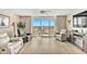 Bright and airy living room with reclining leather furniture and access to balcony at 2151 Bridge View Ct. # 11003, North Myrtle Beach, SC 29582