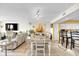 Open-concept living and dining area with hardwood floors and natural light, adjacent to a modern kitchen at 2151 Bridge View Ct. # 11003, North Myrtle Beach, SC 29582