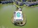 Unique aerial view of the pool on a tiny island with relaxing sun loungers and a calm lake backdrop at 2276 Essex Dr. # H, Surfside Beach, SC 29575