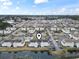 Expansive aerial perspective showcasing the property's layout within a community with lakes and lush greenery at 2276 Essex Dr. # H, Surfside Beach, SC 29575