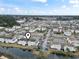 Scenic aerial view of the community featuring multiple ponds and well-maintained apartment buildings at 2276 Essex Dr. # H, Surfside Beach, SC 29575