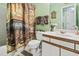 Cozy bathroom featuring a French-themed shower curtain and vanity with a white sink and cabinet at 2276 Essex Dr. # H, Surfside Beach, SC 29575