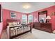 Cozy bedroom with vintage style bed, dresser, and bright pink walls at 2276 Essex Dr. # H, Surfside Beach, SC 29575