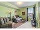 Charming living room showcasing comfortable seating, a window, and soft, light green colored walls at 2276 Essex Dr. # H, Surfside Beach, SC 29575