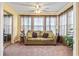 A sitting room featuring large windows with blinds and views to the exterior at 2276 Essex Dr. # H, Surfside Beach, SC 29575