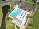 Overhead shot capturing the pool area with sun loungers surrounded by greenery, perfect for relaxation at 2276 Essex Dr. # H, Surfside Beach, SC 29575
