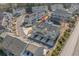 Aerial view of new construction townhomes, water feature, and meticulously landscaped grounds at 2557 Pete Dye Dr. # 402, North Myrtle Beach, SC 29582