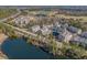 Aerial view of waterfront property, with waterway, golf course, and condo buildings at 2557 Pete Dye Dr. # 402, North Myrtle Beach, SC 29582