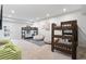 Spacious bunkroom with carpet flooring, two sets of bunks, and bean bag chairs at 2557 Pete Dye Dr. # 402, North Myrtle Beach, SC 29582