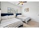 Inviting bedroom with two beds, ceiling fan and ample natural light at 2557 Pete Dye Dr. # 402, North Myrtle Beach, SC 29582