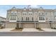 Charming townhome with a two-car garage, stone accents, neutral paint, and beautiful curb appeal at 2557 Pete Dye Dr. # 402, North Myrtle Beach, SC 29582