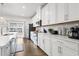 Bright, functional kitchen with stainless steel appliances, white cabinets, and access to the patio at 2557 Pete Dye Dr. # 402, North Myrtle Beach, SC 29582
