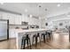 Modern kitchen featuring a large island, stainless steel appliances, and white cabinetry at 2557 Pete Dye Dr. # 402, North Myrtle Beach, SC 29582